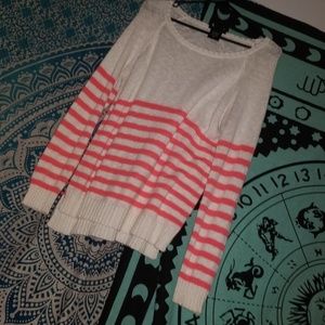 White and salmon colored sweater